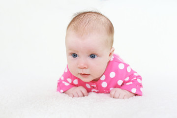 Fototapeta premium lovely 2 months baby girl on belly