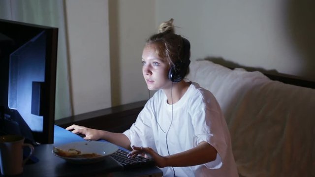 young woman playing video games on your computer. rabid gamer. I lost the game