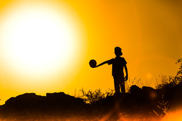 boys play at sunset