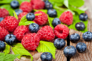 Fresh organic ripe raspberry and blueberry