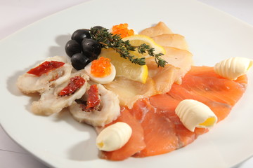 cutting of different fish with caviar and butter