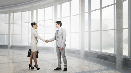 Fototapeta premium Business partners handshake . Mixed media