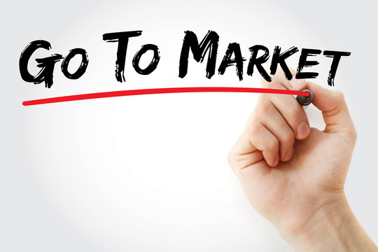 Hand writing Go To Market with marker, concept background