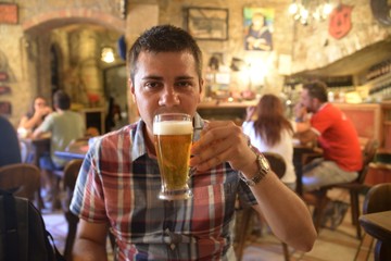 Man drinking beer at a bar