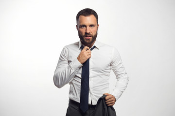 Emotional businessman loosen his tie