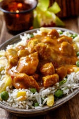 Chicken curry with basmati rice and green peas