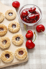 Puff pastry cookies filled with cherry jam