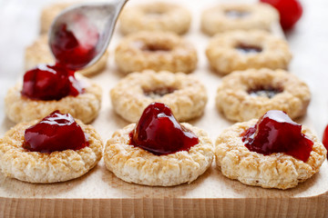 Puff pastry cookies filled with cherry jam