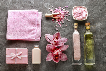 Obraz na płótnie Canvas Spa set: liquid soap, bar of handmade soap, sea salt and towel.