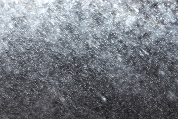 sugar and salt on a dark background