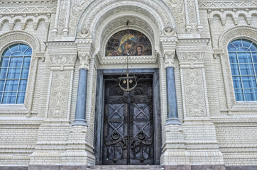 Kronstadt, Russia. The architectural fragment of the Naval cathedral of Saint Nicholas in winter. The icon, the door and the anchor above it.