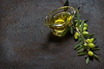 Olive oil and branch with olives