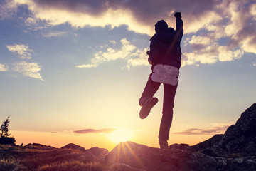 Life goals concept. Woman holding his fist in the air against a