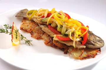 Roast fish with potatoes and vegetables