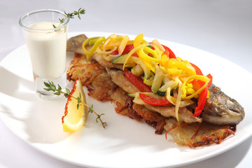 Roast fish with potatoes and vegetables