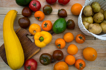 Colorful vegetables on wooden background.