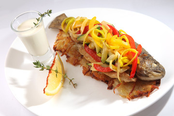 Roast fish with potatoes and vegetables