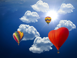 beautiful scene by hot air balloons on the cloudscape and sun