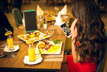 Taking food photos in restaurant