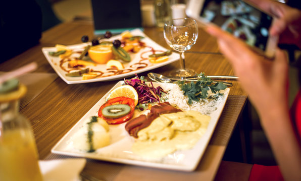 Taking food photos in restaurant