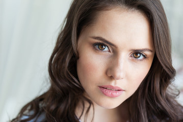 Obraz premium Close up portrait of beautiful young woman face