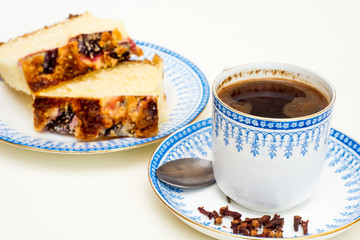 breakfast with coffee and slices of plum cake