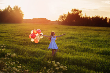 young women with balloons outdoor