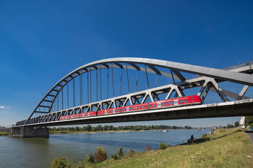 Bridge and red train over Rhein close to Dusseldorf