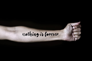 text nothing is forever in a forearm