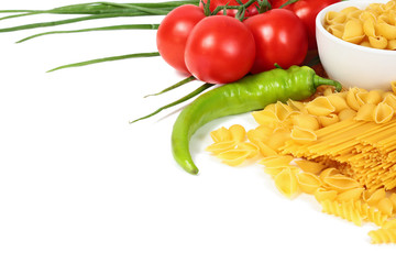 Different types of raw Italian pasta with tomatoes and other vegetables. Top view background. Copy space