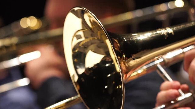 Closeup film of fragment trumpet. Instrument closeup on focus and focusless.