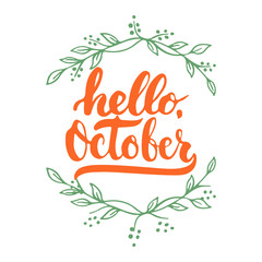 Hand drawn typography lettering phrase Hello, October isolated on the white background with wreath. Fun brush ink inscription for photo overlays, greeting and invitation card or t-shirt print design