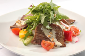 Salad with beef tongue and sauce
