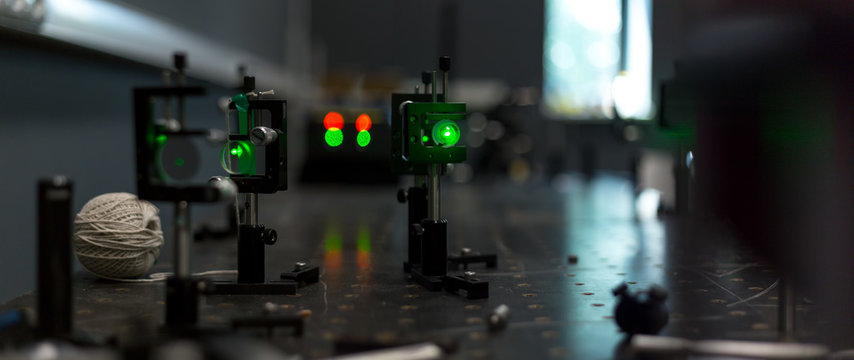 green lasers in the laboratory, laser beams among the optical elements, the study of light and cognitive phenomena