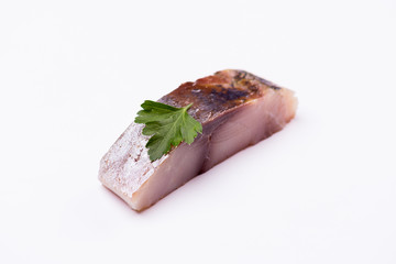 a piece of fish on a white background, photo studio, isolated, herbs, meal