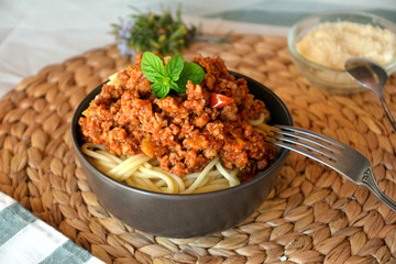 Spaghetti bolognese with meat, tomato sauce and vegetables