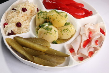 salty snacks and boiled potatoes with dill
