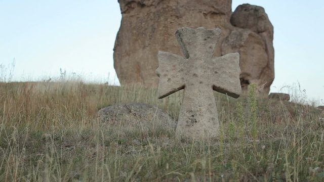 Very old stone cross in cemetery near Pidkamin