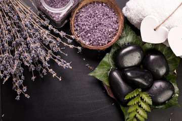 spa concept with stones, flowers , essential oils and mineral salt