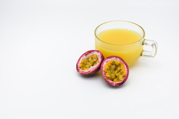 Passion fruit juice with two half passion fruit  isolated on whi