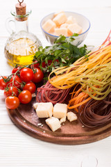  Vegetable color Pasta, oil,tomatoes,cheese on wooden table. italian food