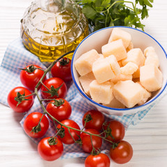 cheese , cherry tomatoes,oil and fresh parsley- ingredients for  salad