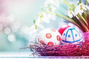 Easter concept with colorful eggs on wooden background