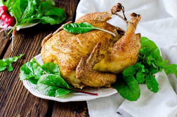 Baked chicken with spices and chard leaves