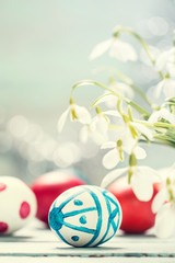 Easter concept with colorful eggs on wooden background