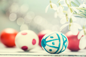Easter concept with colorful eggs on wooden background