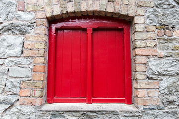 close up of vintage window in old stone wall