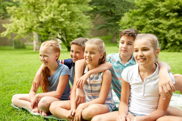 Fototapeta premium group of happy kids or friends outdoors