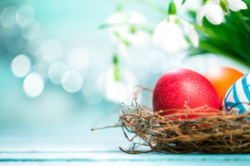 Easter concept with colorful eggs on wooden background