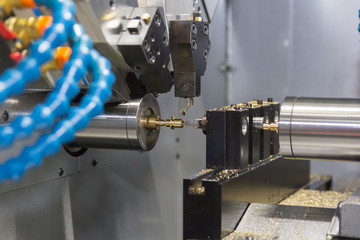 Steel metal cutting machine process by CNC lathe in workshop